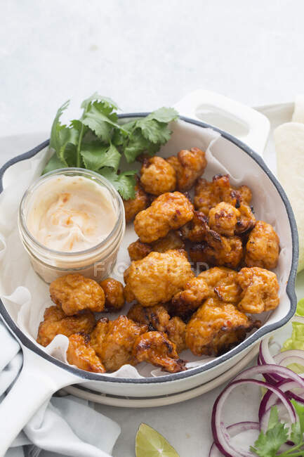 Fried cauliflower bites with a dip — Stock Photo