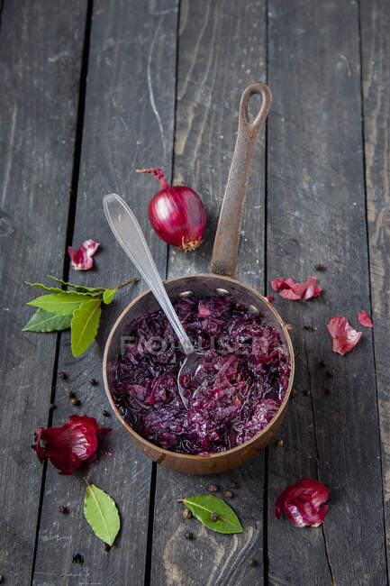 Homemade beetroot soup and spoon, on wooden background — Stock Photo