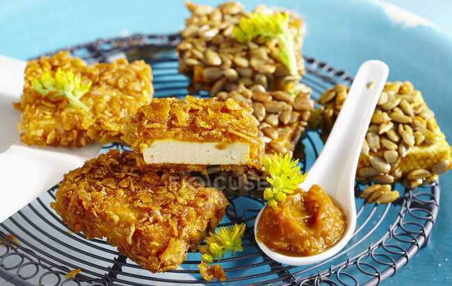 Breaded tofu snacks with cornflakes and sunflower seeds — Stock Photo