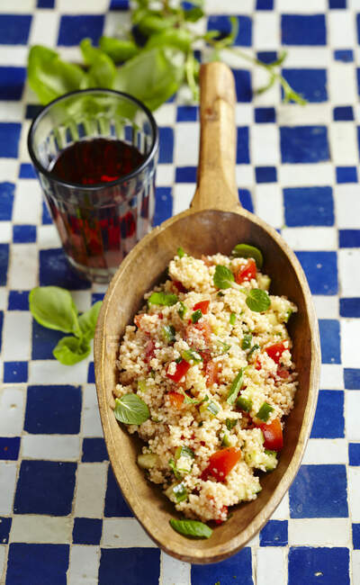 Tabbouleh with tomatoes, cucumbers and mint — Stock Photo