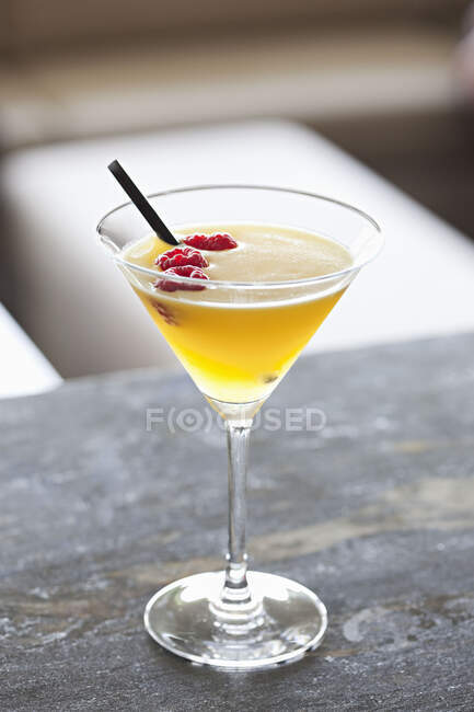 Glass of tasty cocktail with lemon and mint on table — Stock Photo