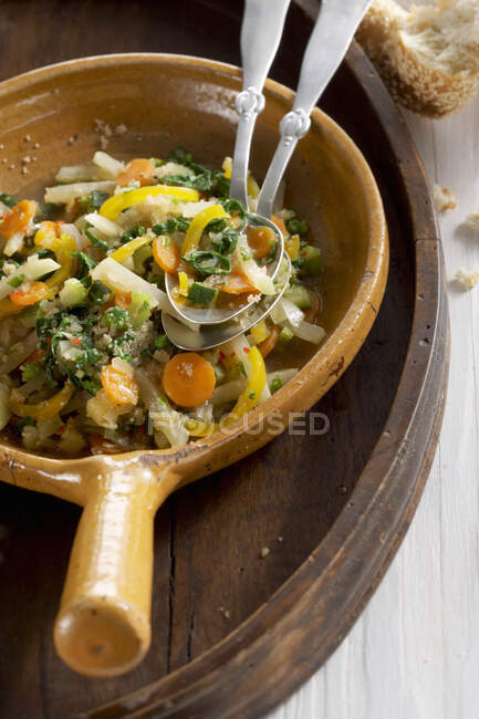 Colourful amaranth vegetable stew in a clay bowl — Stock Photo