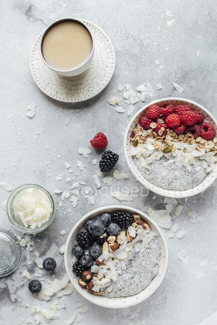 Chia pudding with coconut milk, berries, nuts, granola and coffee — Stock Photo