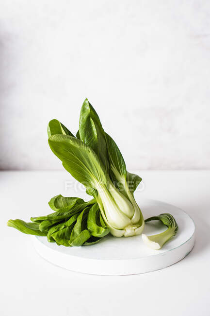 Pak choi in white plate — Stock Photo