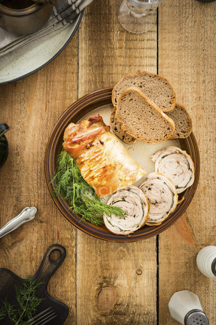 Roast veal sliced with dill and bread — Stock Photo