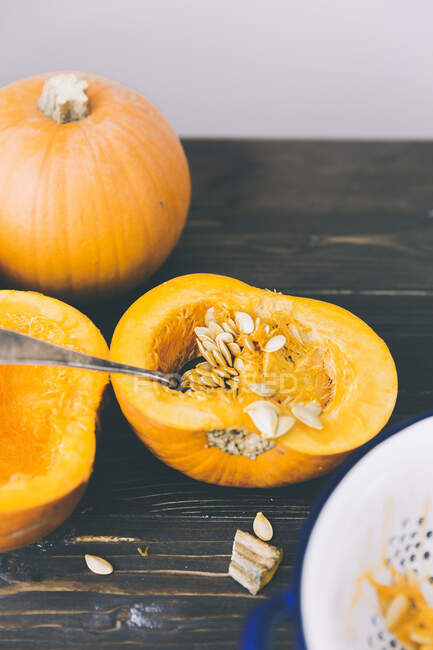 A pumpkin being deseeded — Stock Photo