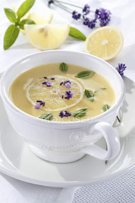 Lemon and chicken soup with lavender — Stock Photo