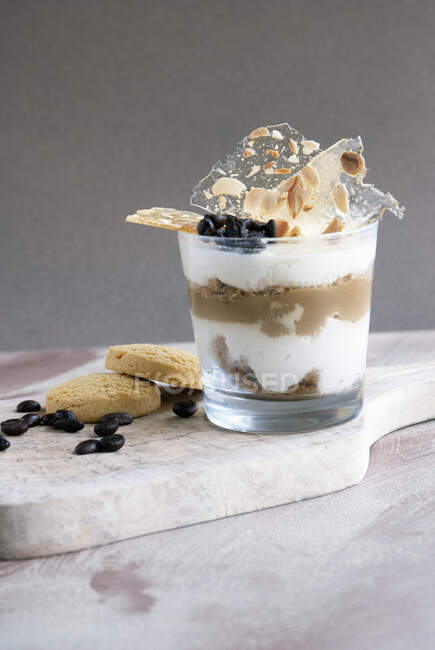 Coffee flavored dessert with mascarpone, tiramisu in glass — Stock Photo