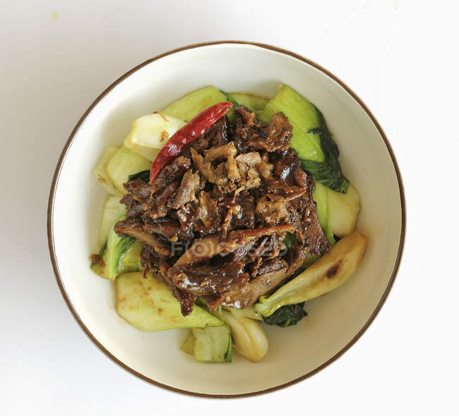 Spicy duck with salted pak choi — Stock Photo