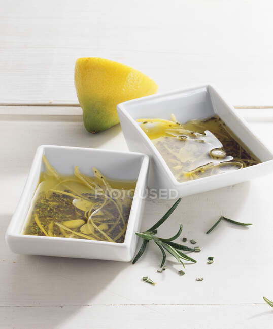 Rosemary and lemon grill marinade with garlic and oil — Stock Photo