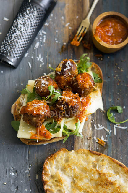 Vegetarian meat substitute meatballs with swiss cheese and a tomato sauce in a sub — Stock Photo