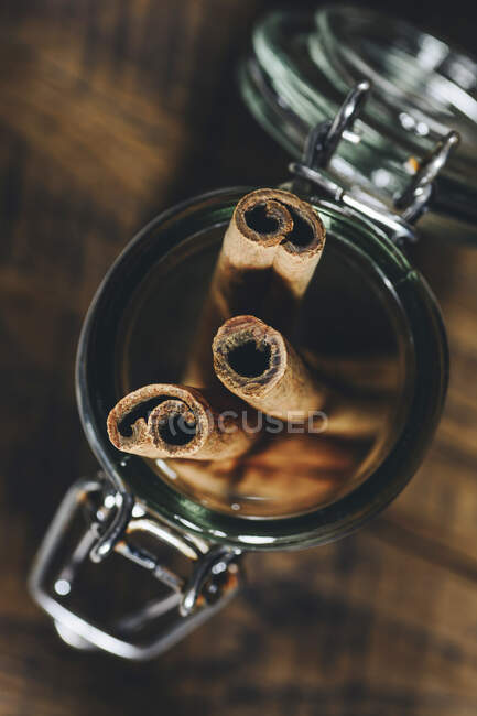 Close-up shot of delicious Cinnamon sticks in glass jar — Stock Photo