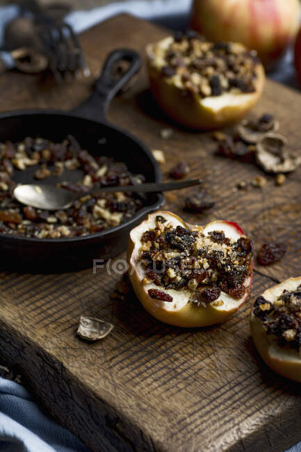 Baked apples with walnuts, raisins and dried plums — Stock Photo
