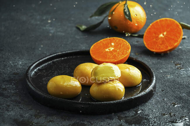 Mochi ice cream with tangerine — Stock Photo