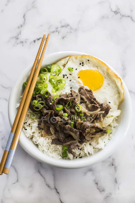 Gyudon bowl with rice, beef and fried egg — Stock Photo