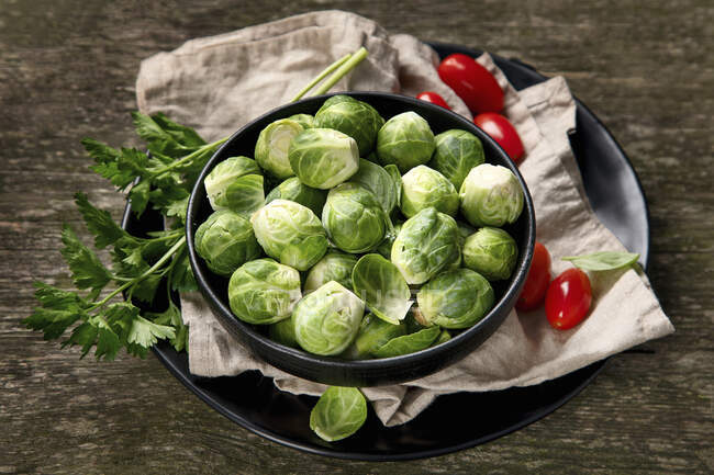 Brussels sprouts on wooden table — Stock Photo