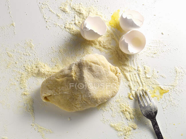 Pasta dough and egg shells — Stock Photo