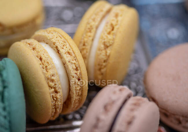 Mini macarons with cream, close up shot — Stock Photo
