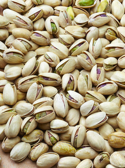 Pistachio nuts with shells, close up shot — Stock Photo