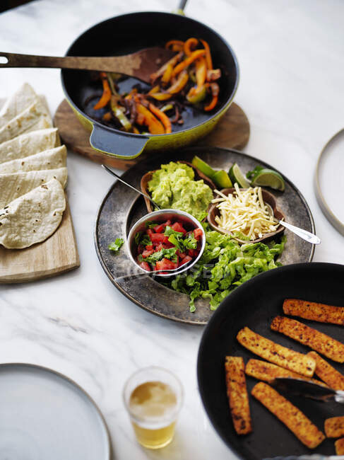 Mexican fajitas meal with dishes to make your own tacos — Stock Photo