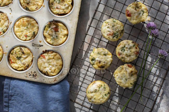 Mage from eggs, grated potatoe, onion, peppers, courgette and goats cheese — Stock Photo