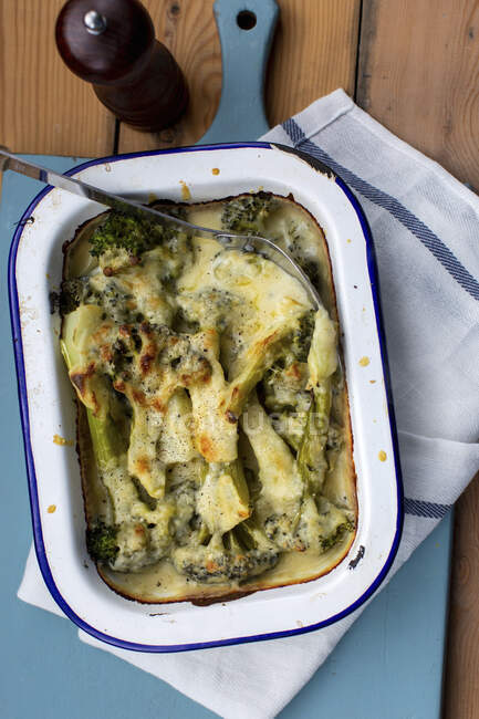 Broccoli with cheese sauce — Stock Photo