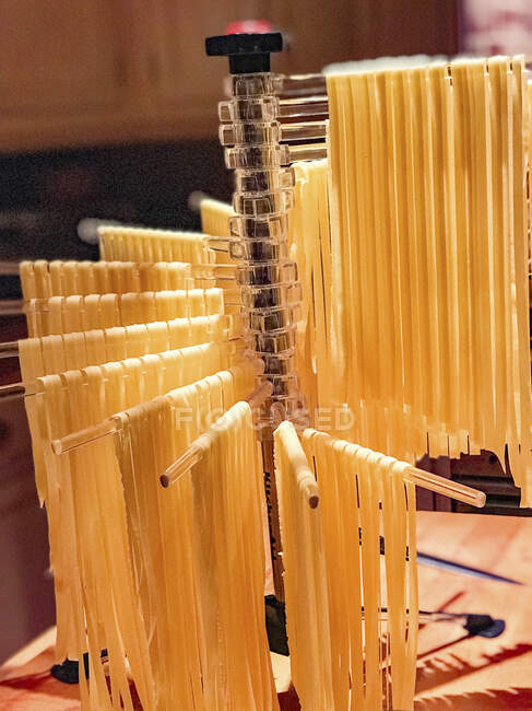 Tagliatelle on a drying rack — Stock Photo
