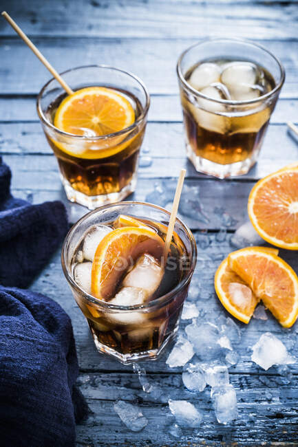 Spanish vermouth cocktails with ice and oranges — Stock Photo
