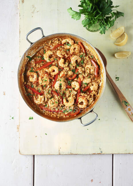Close-up shot of delicious Prawn paella with red peppers — Stock Photo