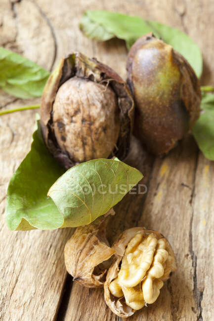 Fresh walnuts on a wooden background — Stock Photo