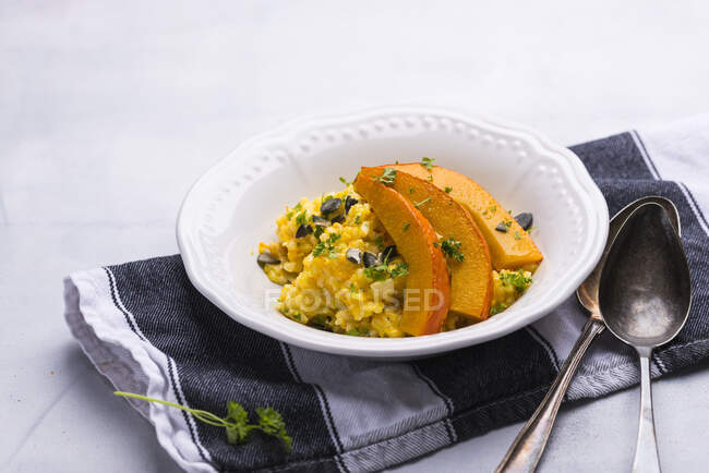 Vegan pumplin risotto with grilled pumpkin strips — Stock Photo