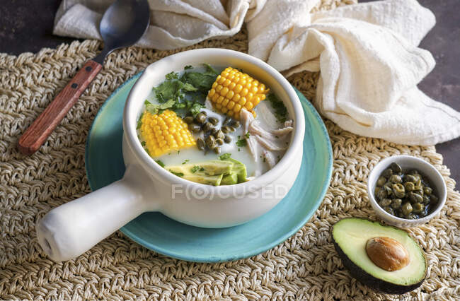 Ajiaco Colombiano - Latin American potato soup with avocado — Stock Photo