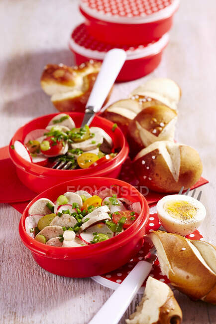 White sausage salad with bread rolls in plastic containers to take away — Stock Photo