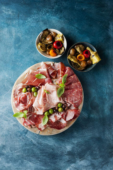 Prosciutto sandwich with ham, salami, cheese and olives. top view. — Stock Photo