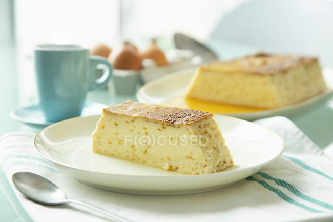 Spanish egg pudding portions on plates — Stock Photo