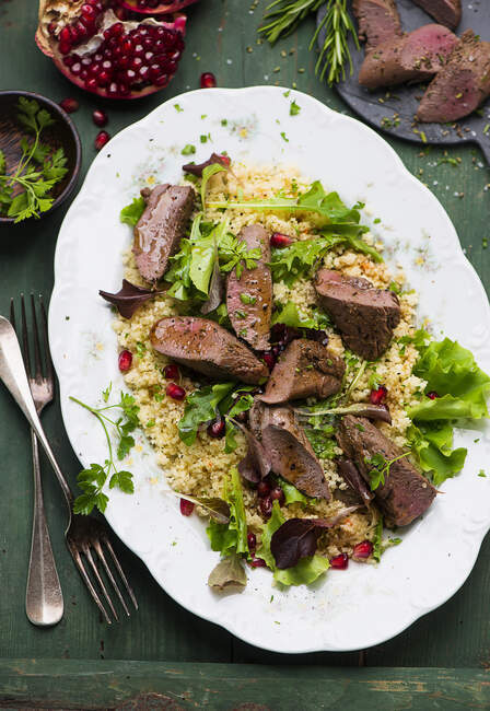 Lamb fillet with pomegranate couscous — Stock Photo