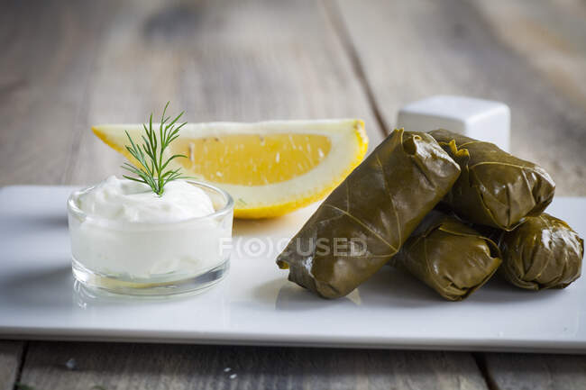 Greek dolmades with a yoghurt dip — Stock Photo