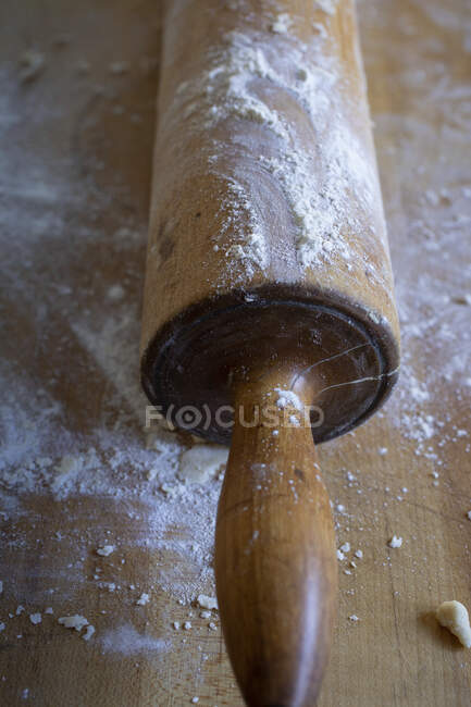 Floured Rolling Pin with Red Handles — стоковое фото