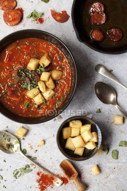 Tomato soup with chorizo and fried croutons — Stock Photo