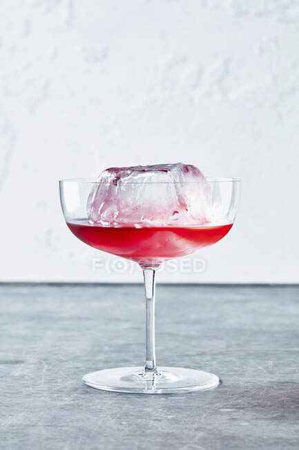 Huckleberry Cocktail with ice rock in elegant glass — Stock Photo