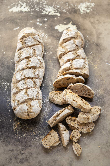 Close-up shot of delicious Two spelt baguettes, sliced — Stock Photo