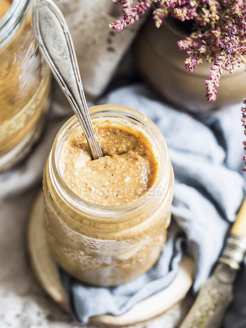 Natural organic hazelnut butter in a jar — Stock Photo