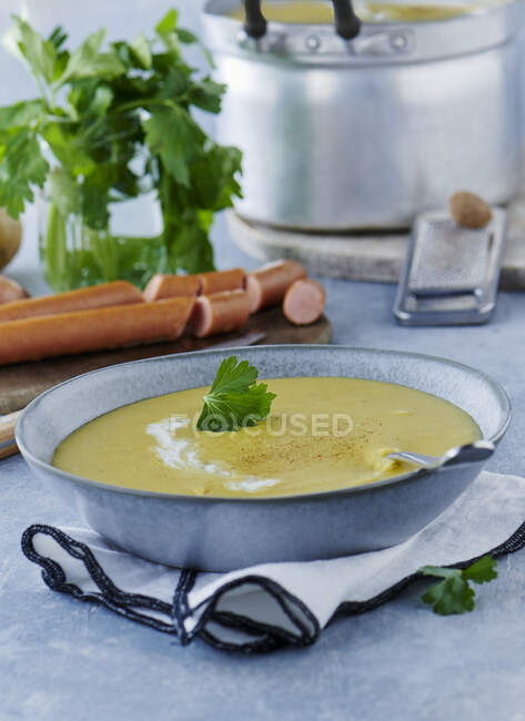 Potato soup with bockwurst and parsley — Stock Photo