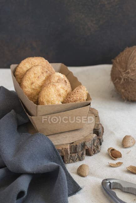 Coconut cookies box with nuts and fresh coconut — Stock Photo