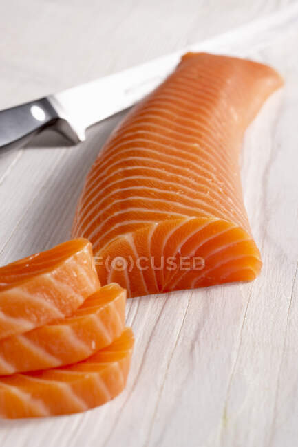 Smoked salmon fillet on a wooden surface — Stock Photo