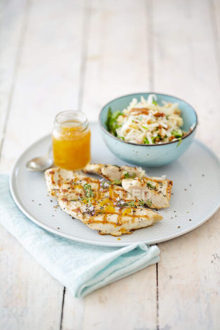 Turkey steak with marmalade and an apple and celery salad — Stock Photo