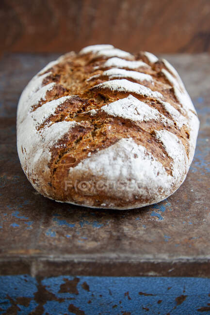 Close-up shot of delicious long loaf of sour dough bread — Stock Photo