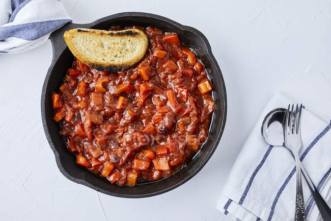Tomato salsa prepared in cast iron skillet — Stock Photo