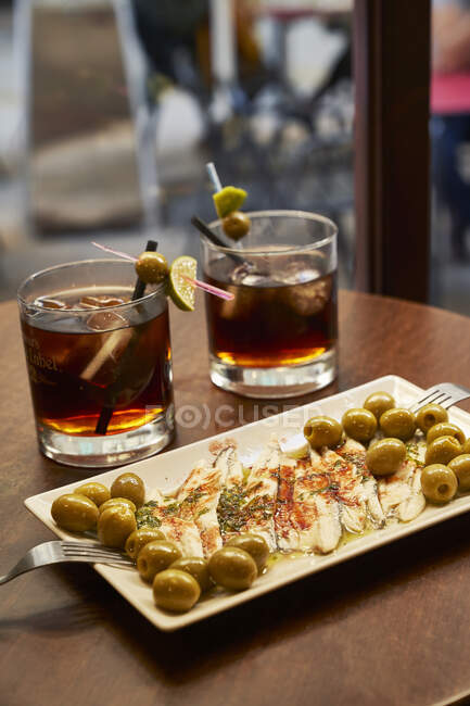 Vermouth with green olives and anchovies — Stock Photo