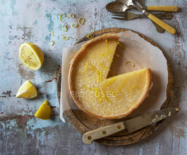 Lemon tart with lemon rind gratings — Stock Photo